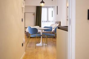 a dining room with a table and chairs and a room at Solemar Sicilia - Torre Maqueda in Palermo +182 photos