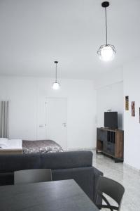 a living room with a couch and a table at Suite in Città residence in Isernia