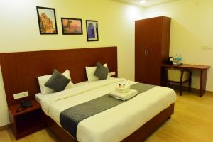 a bedroom with a large bed in a room at The Marwar regency Hotel in Jodhpur