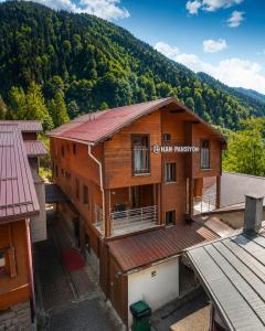 an overhead view of a building with a mountain in the background at Han PANSİYON in Çaykara