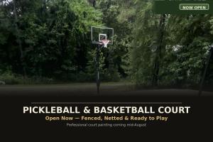 a basketball hoop in the middle of a park at Big Pine Gathering - Heated Pool - Pickleball - Sleeps 16 in Broken Bow