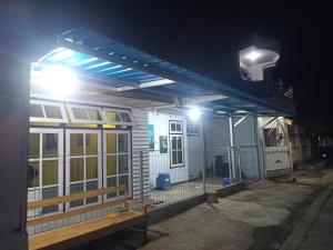a house under construction at night with lights at Wahid Homestay in Ketapang