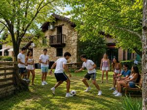 a group of young people playing with a soccer ball at Casa rural Paraje de Yuste in Cuacos de Yuste