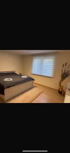 a bedroom with a large bed and a window at Ferienoase am See in Möhnesee +22 photos