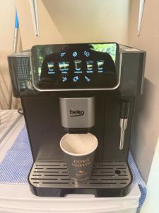 a coffee maker sitting on top of a table at House 220 in London