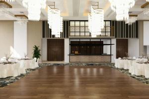 a banquet hall with white tables and chandeliers at TownePlace Suites by Marriott Vaughan in Vaughan +6 photos