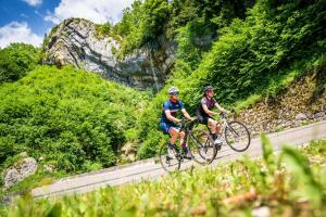 two people riding bikes on a mountain road at L'inattendu in Les Piards