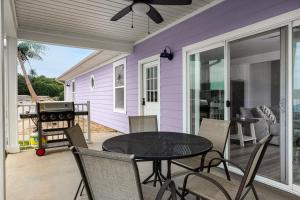 a patio with a table and chairs and a grill at Coconuts RV Resort in Gravois Mills