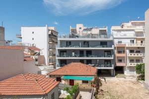 an overhead view of buildings in a city at PROPAN CITY SUITES in Volos