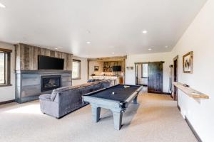 a large living room with a pool table in it at Peaceful Bay Getaway in Lakeside
