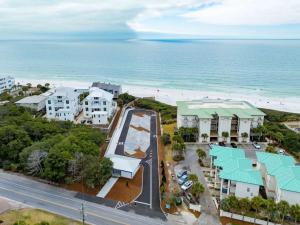 an aerial view of a resort with the beach at Happy Days - Seagrove Highlands in Santa Rosa Beach