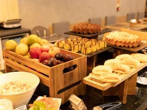a buffet with different types of fruits and pastries at ibis Araguaína in Araguaína