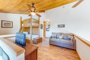 a living room with a bed and a couch at Summit 70 in Mammoth Lakes +110 photos