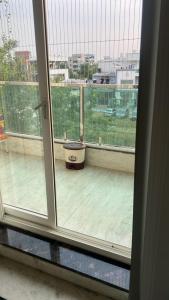 a view of a balcony from a window at PR PREMIUMSUITs in Surūrnagar