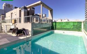 a swimming pool on the roof of a house at Rent Montañeses Nuñez in Buenos Aires