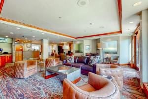 a living room with a couch and chairs and a table at Lion Square Lodge South 451 in Vail