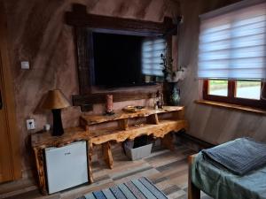 a bathroom with a sink and a mirror in a room at Lukin salaš broj 3 in Ratkovo