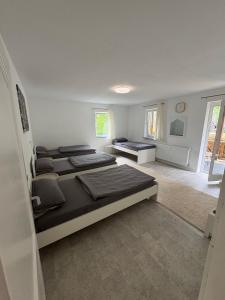 a room with three beds in a room at Home15 Kassel in Kassel