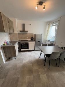 a kitchen with a table and a dining room at Home15 Kassel in Kassel