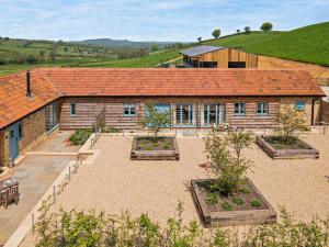 a house with a garden in front of it at 1 Bed in Stoke Abbott oc-35012 in Burstock