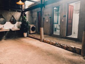 a bathroom with a toilet and a sink and mirrors at Nùng An homestay-Nùng ethnic group in Bà Dương +52 photos