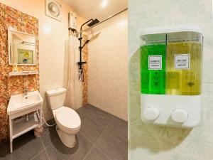 a bathroom with a toilet and a sink at สวนไมตรีจิต รีสอร์ท Suan Maitrichit Resort in Ban Khlong Si +172 photos