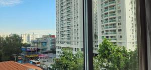 a view of a city from a window at Alugo Suite 303 No Mont Blanc in Nova Iguaçu