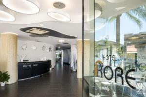 a lobby of a store with a sign that says hope at Hotel Kore in Villaggio Mosè