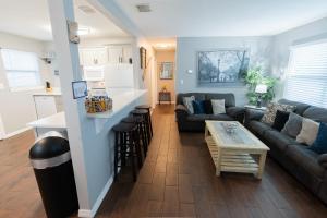 a living room with a couch and a table at The Cocoa Cove in Cocoa