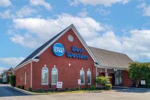 a large red building with a big best western sign on it at Best Western Fredericksburg in Fredericksburg