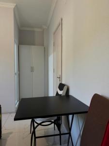 a black table and a chair in a room at Hotel Palm Gonio in Kvariati +27 photos