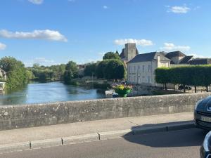 a view of a river from a bridge at De passage in Nemours