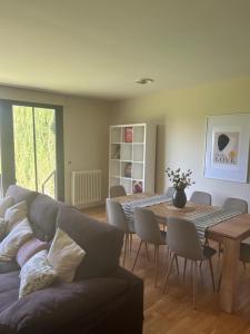 a living room with a couch and a table at Vivienda Turística Lorena in Cascante