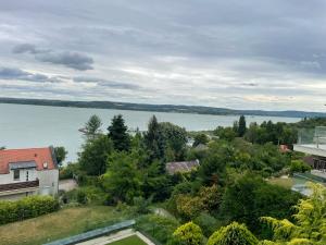 a view of the water from a house at T8 Sunset Tihany in Tihany