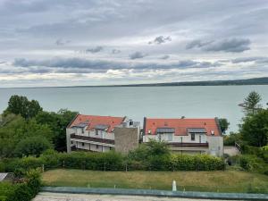 a group of houses with a view of the water at T8 Sunset Tihany in Tihany
