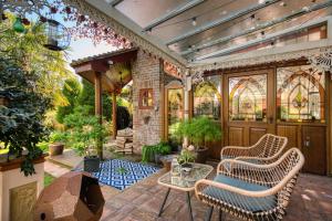 a patio with two chairs and a table at Hillsley House in Wirksworth
