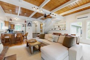 a living room with a couch and a table at Quechee's Cloud 9 in Hartford