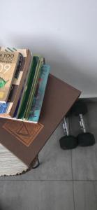 a box full of books sitting on top of a table at Urban tropics in Colombo