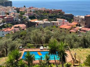 a view of a city with a swimming pool at Corte Degli Ulivi Resort in Vico Equense