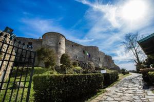 an old castle with a fence in front of it at Il Vicolo in Vibo Valentia