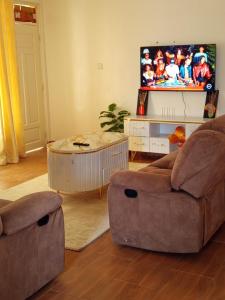 a living room with a couch and a coffee table at Kitengela prime suites in Kitengela 