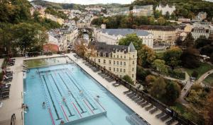 an overhead view of a large swimming pool in a city at Visit sauna Klinovec in Loučná pod Klínovcem