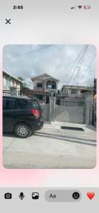 a car parked in front of a house at The Rose Garden in Georgetown