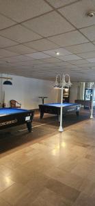 a room with two ping pong tables in it at Jasmin mit Sauna und Schwimmbad in Hohegeiß