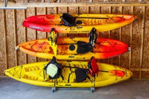 a group of kayaks lined up against a wall at Maison Rouge by Simple Life Rentals in Luxemburg