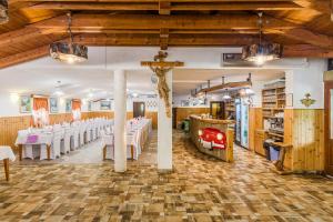 a banquet hall with white tables and white chairs at Turistična kmetija Široko in Tolmin
