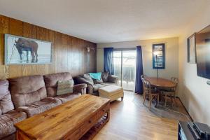 a living room with a couch and a table at Mountian View Condo Unit S303 in Dillon