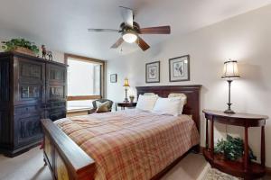 a bedroom with a bed and a ceiling fan at Vail Spa 301 in Vail +55 photos