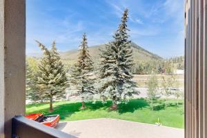 a window with a view of a group of trees at Vail Spa 301 in Vail