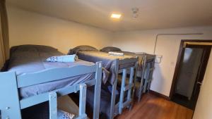 two bunk beds in a room with a hallway at Torre al Sur in Ushuaia